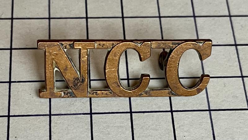 Non Combatant Corps (NCC) Brass Shoulder Title / Cap Badge